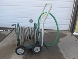 lot 125 image: Rolling Metal Hose Rack wHose