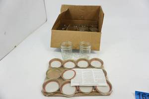 lot 161 image: Ball 12 Regular Tapered Half-Pint Can-or-Freeze Jars with Covers