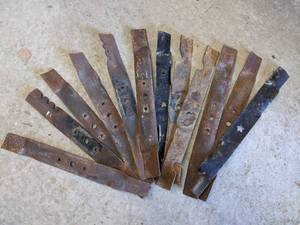 lot 252 image: One Dozen Rusty Mower Blades