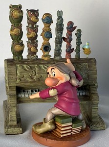 lot 72 image: Disney Collectible WDCC Humpf (Grumpy at his organ) from Snow White and the Seven Dwarfs