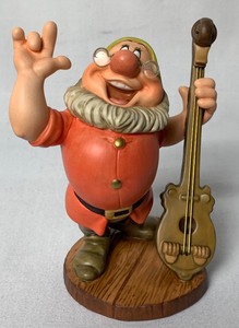 lot 73 image: Disney Collectible WDCC Cheerful Leader (Doc) from Snow White and the Seven Dwarfs