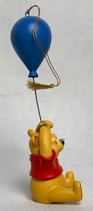 lot 79 image: Disney Collectible WDCC Up To The Honey Tree Ornament (Pooh) from Winnie The Pooh and the Honey Tree