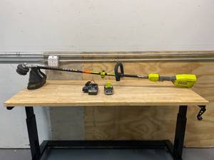 lot 56 image: One 18-Volt Lithium-Ion Cordless Attachment Capable Brushless String Trimmer.  Battery and Charger Included.