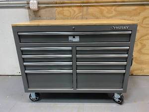 lot 65 image: HUSKY 46 in. W 9-Drawer, Deep Tool Chest Mobile Workbench in Gloss Gray with Hardwood Top