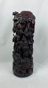 Tall intricately carved sculpture
