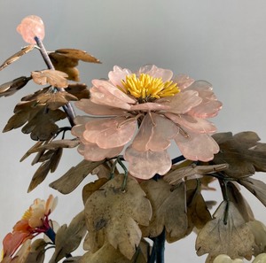 Delicate stone flowers in jade vase