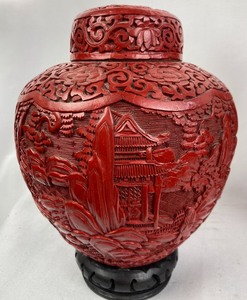 Pair of Red Carved Urns