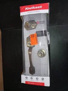 lot 22 image: Belleview Antique Brass Single Cylinder Door Handleset with Tylo Door Knob Featuring SmartKey Security by Kwikset- never used
