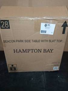 lot 62 image: Beacon Park Steel Wicker Outdoor Accent Table by Hampton Bay- never used