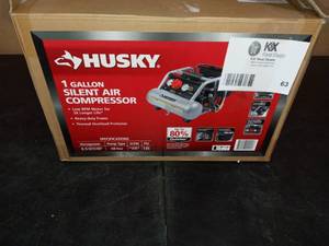 lot 63 image: 1 Gal. Portable Electric-Powered Silent Air Compressor by Husky - never used