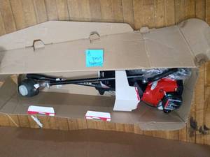 lot 87 image: 2-Cycle 26 CC Straight Shaft Gas Trimmer by Homelite- slightly used