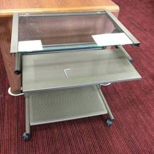 lot 18 image: GREY METAL PORTABLE CONTEMPORARY DESK WITH SLIDE OUT DRAWER & GLASS TOP - GREAT CONDITION