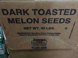 lot 241 image: 40 lb. Box Dark Toasted Melon Seeds...