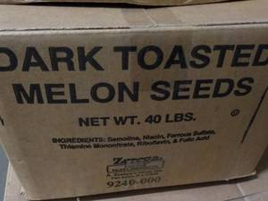 lot 243 image: 40 lb. Box Dark Toasted Melon Seeds...