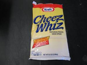 lot 337 image: 6.5 lb bag Kraft Cheez Whiz needs no refrigeration till opened.  Dated 4-1 2021