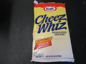 lot 338 image: 6.5 lb bag Kraft Cheez Whiz needs no refrigeration till opened.  Dated 4-1 2021