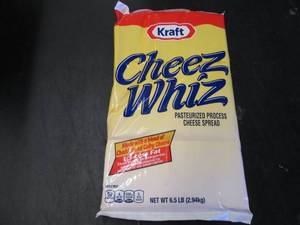 lot 339 image: 6.5 lb bag Kraft Cheez Whiz needs no refrigeration till opened.  Dated 4-1 2021