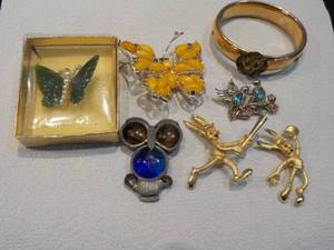 animal pins, bracelet, and ball and...