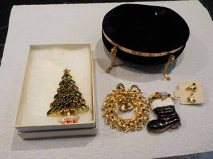 Christmas pins and earrings with an...