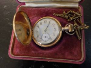 Pocket watch with chain in a displa...