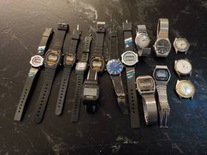 variety of watches in a plastic sto...