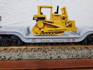 lot 120 image: Lionel Union Pacific Flat Car with Ertl Bull Dozer 6-18935