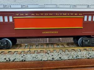 lot 148 image: Lionel Chicago & Alton Illuminated Armstrong Baggage Car 6-9554