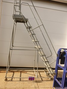 8 Cotterman rolling ladder. Used condition. Has minor dings & scrapes but is a working unit. As shown. THIS ITEM HAS A RESERVE.