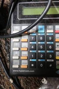 lot 108 image: Hypercom Credit Card Terminal & Box of Cables
