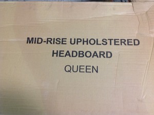 lot 113 image: Mid Rise Upholstered Queen Headboard not used see pictures