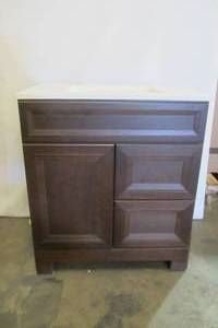 lot 75 image: Sedgewood 30-12 in. W Bath Vanity in Dark Cognac with Solid Surface Technology Vanity Top(DAMAGED) in Arctic with White Sink (no faucedamage near foot on Right))