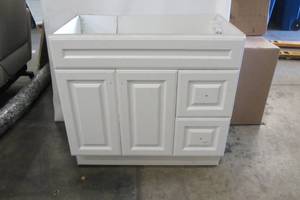 lot 79 image: Glensford 36 in. W x 22 in. D x 34 in. H Bath Vanity Cabinet in White (Damage on Back)