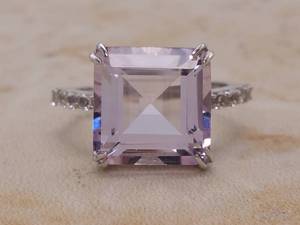 lot 60 image: Fancy Amethyst and White Topaz Ring