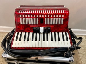 lot 40 image: Iolite 34 Key Accordion w Case- Cherry Red