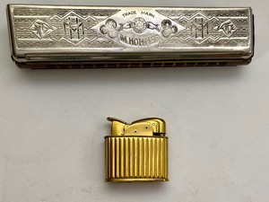 lot 68 image: Vintage Echo Hohner Harmonica & Evans Fuel Lighter