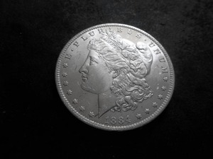 lot 9 image: 1884 O Morgan Silver Dollar