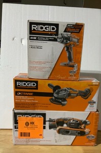 lot 49 image: RIGID MIX COMBO TOOLS WITH 18V OCTANE ANGLE GRINDER & IMPACT WRENCH FOLLOWED BY 6.5 AMP CORDED HEAVY-DUTY VARIABLE SPEED BELT SANDER SEE PICS