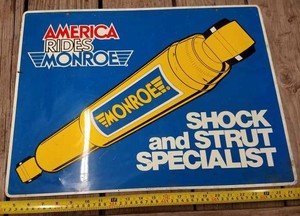 2-Sided America Rides Monroe Shock and Strut Specialist Metal Sign 24 inches by 18 inches