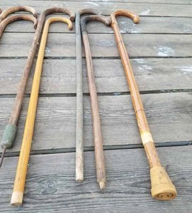 Collection of 10 Wooden Canes including one with an Ice Tip and one with a wood dowel added for height