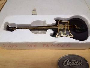 Electric Guitar Shaped Music Box, Capital Belt Buckle, 4-Country Music CDs and a Pair of Davy Crockett Toy Horse Shoes