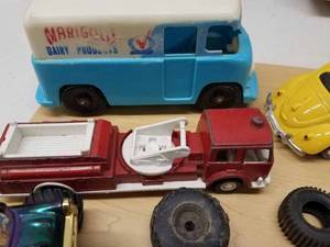 13 Assorted Toy Cars and Trucks along with Car Parts and Tires