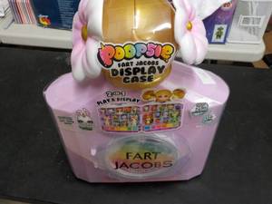 lot 17 image: Poopsie Fart Jacobs Display Case...