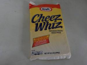 lot 175 image: 6.5 lb. pkg Kraft Cheez Whiz needs...