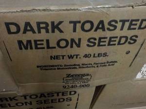 lot 355 image: 40 lb. Box Dark Toasted Melon Seeds...