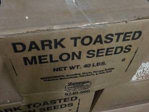 lot 356 image: 40 lb. Box Dark Toasted Melon Seeds...