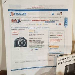 lot 509 image: Canon EOS Rebel SL1 18MP SLR with Zoom Lens