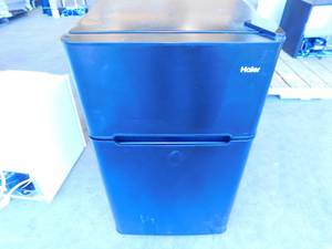 lot 7 image: Haier Mini Black Refrigerator