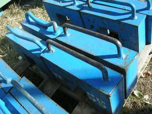 lot 8 image: Four 55lb Tractor Weights