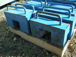 lot 10 image: Four 55lb Tractor Weights
