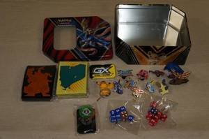 lot 59 image: Metal Tin of Pokemon Pins and Game Accessories